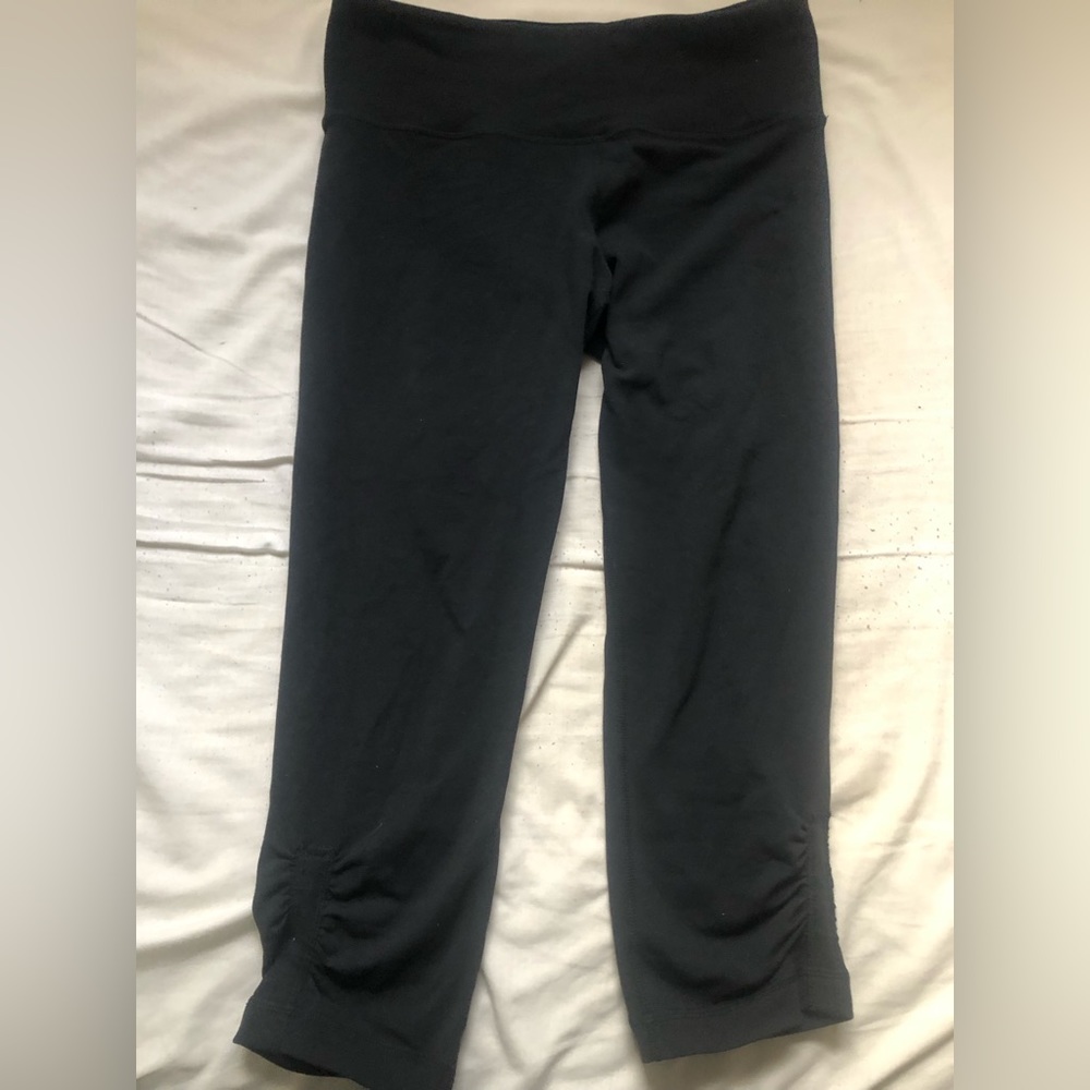 Lululemon black leggings slightly cropped ruching on the bottom